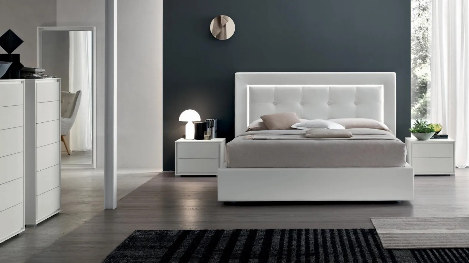 Double bed with classic headboard in capitonné processing with integrated Deo Light by Maronese Acf.